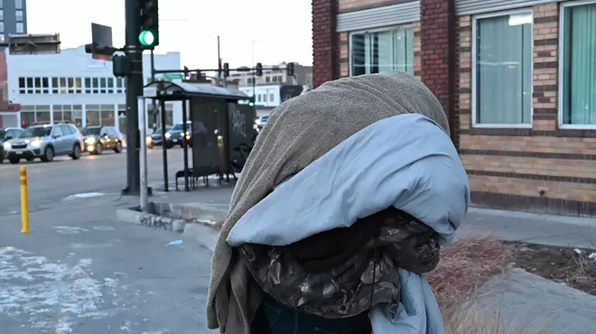 Homeless resident Josh Rush looks for a place to get warm.
