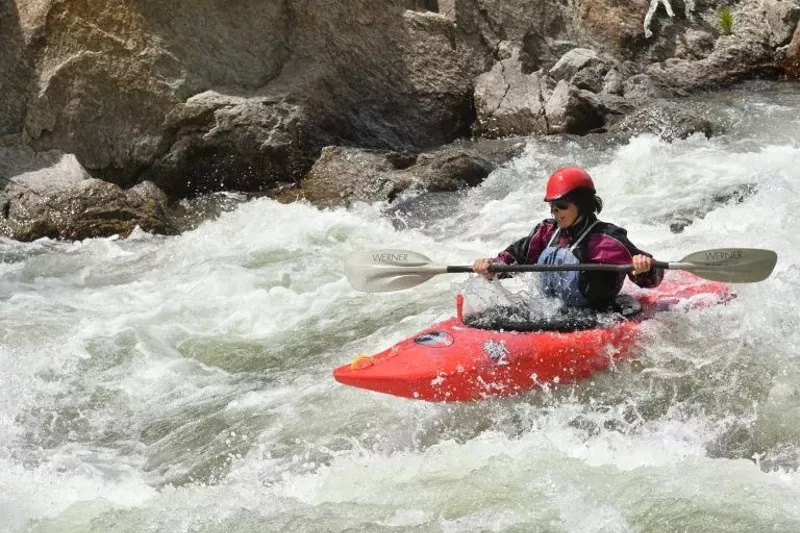 Image: Stacy Gold kayaking Brown's Canyon of the Arkansas River by Salida.
