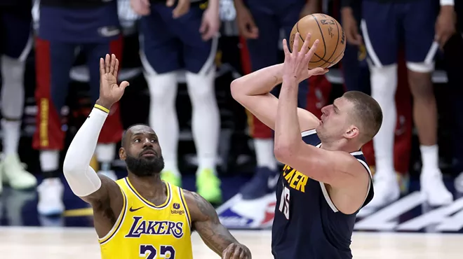 Nikola Jokic shoots over LeBron James