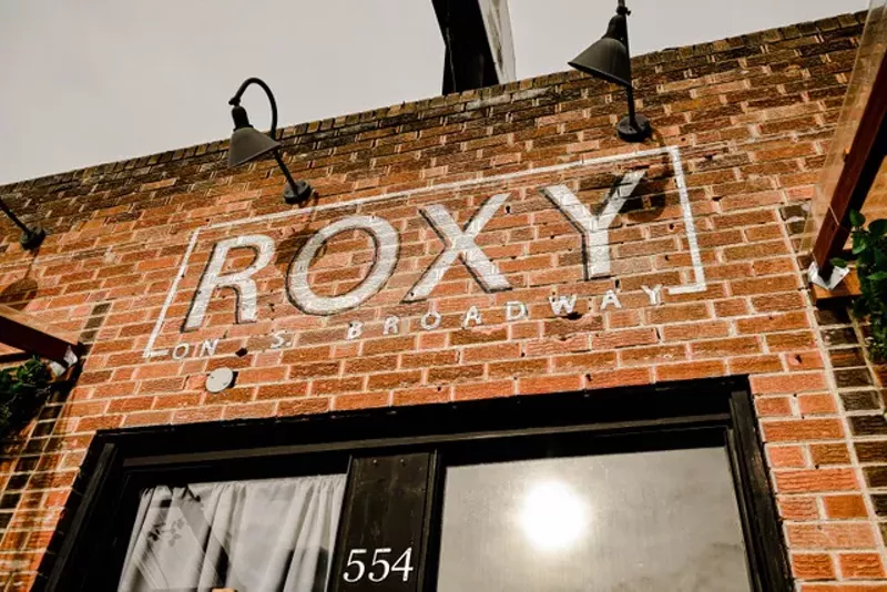 Image: sign on brick building reading Roxy