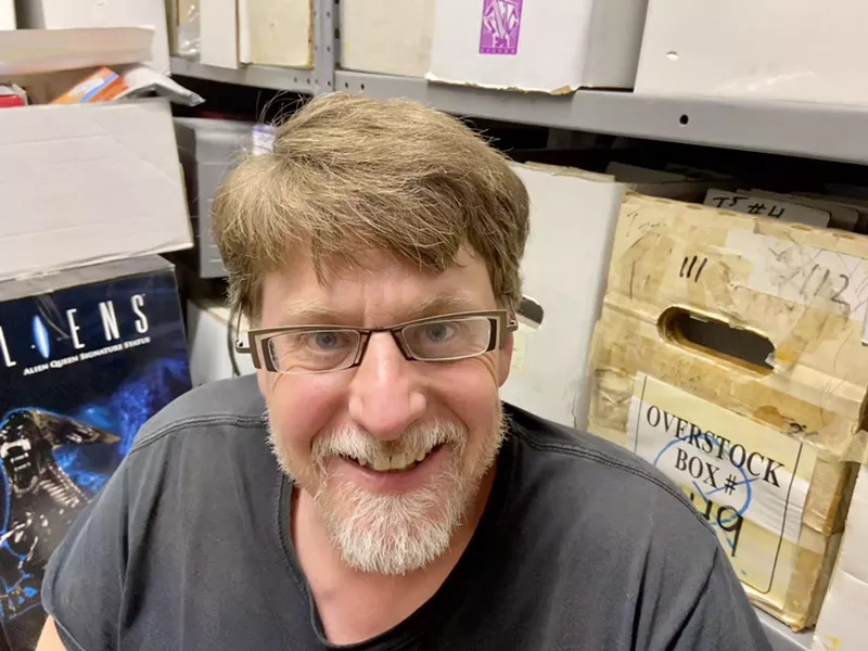 Image: Tim Collins, with his hoard in the background.