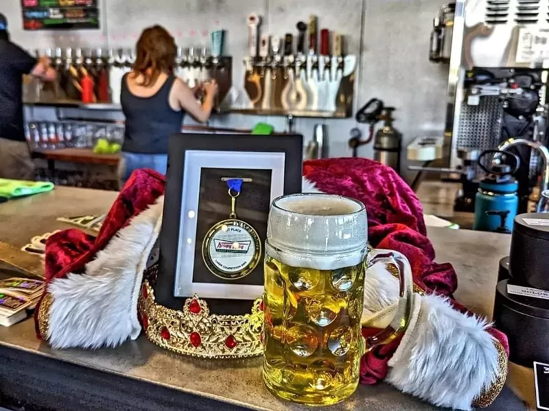 Image: Crown and medal and beer.