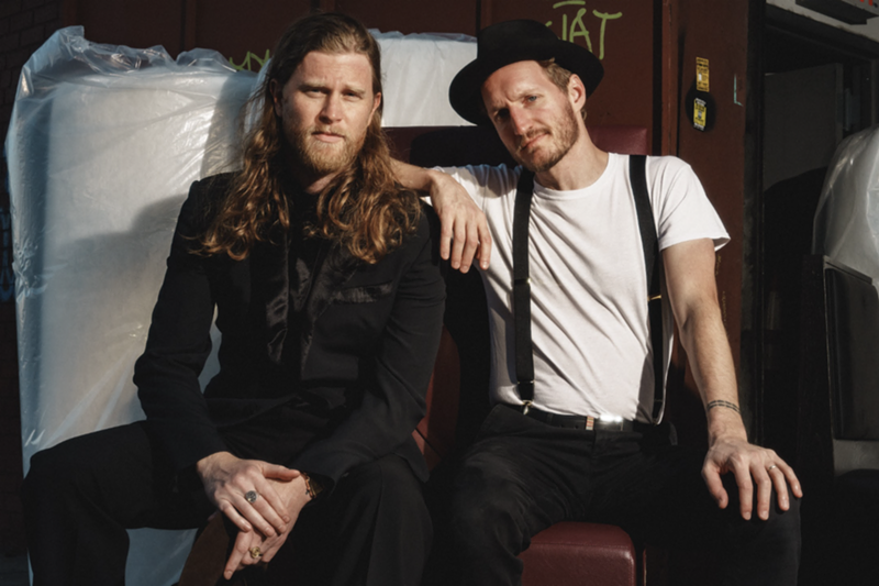 Image: two members of the lumineers