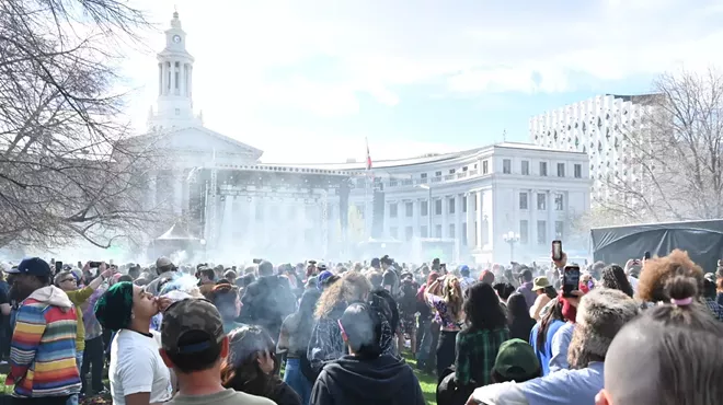 A smoke cloud rises.