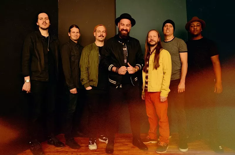 Image: The Motet's drummer Dave Watts (second from right) lost his home in the Marshall Fire.