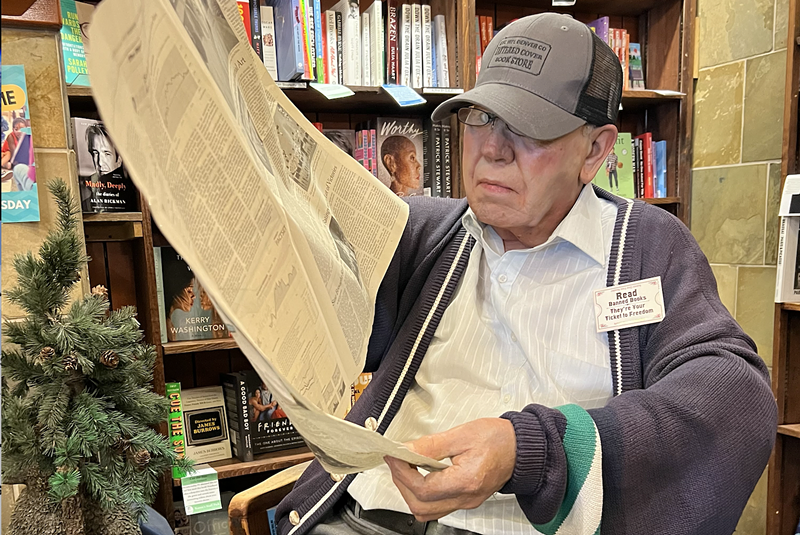 Image: Charlie the Mannequin reading a newspaper