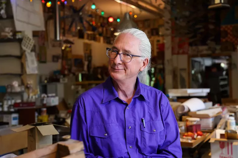 Image: man in purple shirt