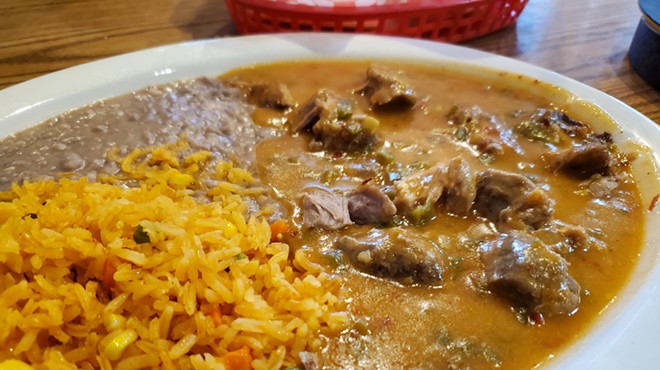 green chile, rice and beans on a plate