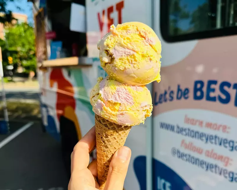 Image: A person holding a vegan ice cream cone backdropped by Best One Yet's truck
