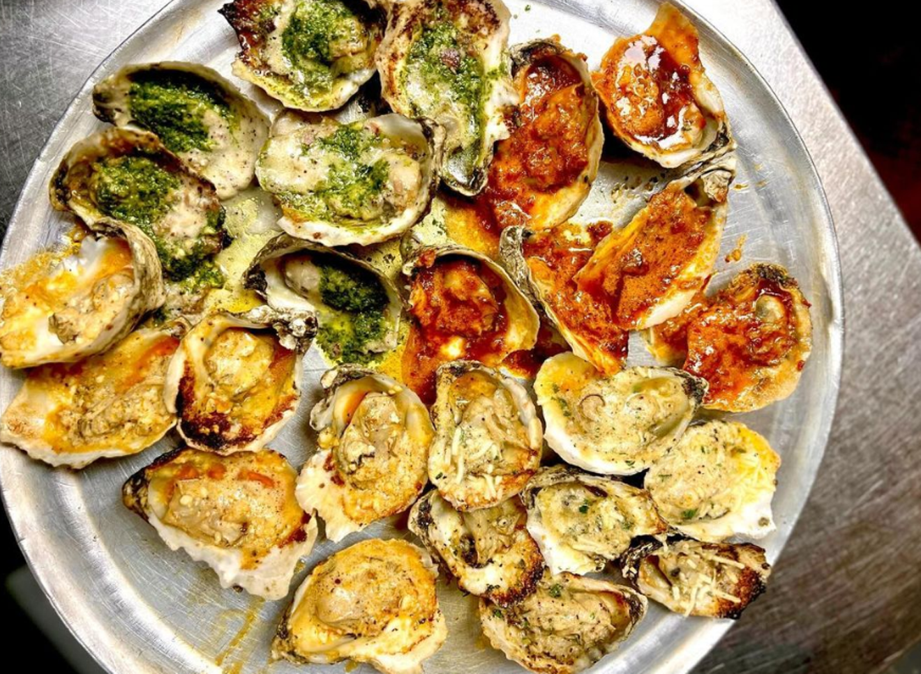 The chargrilled oysters from Angelo's are one of the best parts of its happy hour lineup.