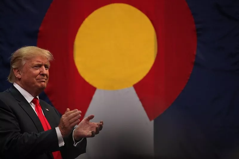 Image: donald trump clapping by Colorado flag