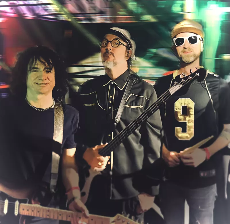 Image: the members of the band Primus pose for a picture