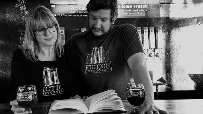 Two brewery owners behind the bar.