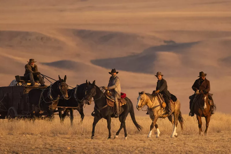 Image: men on horses in West