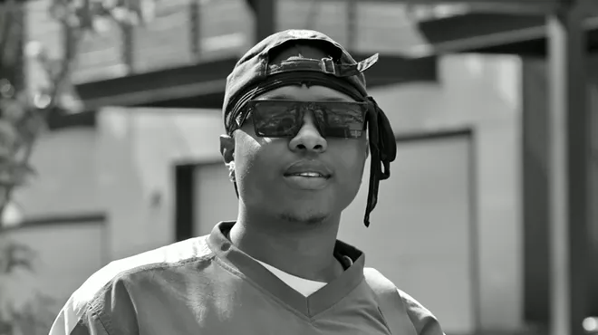 man in a hat and sunglasses