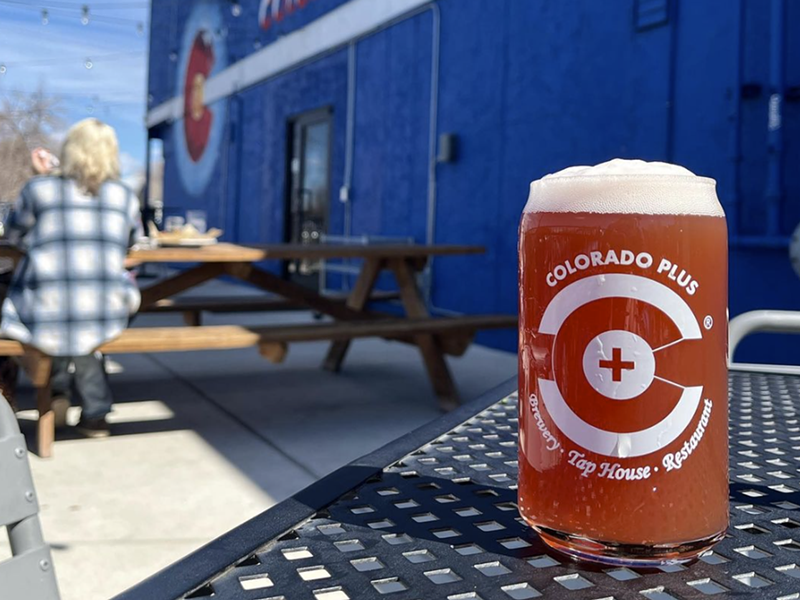 Image: a glass of beer on a table outside