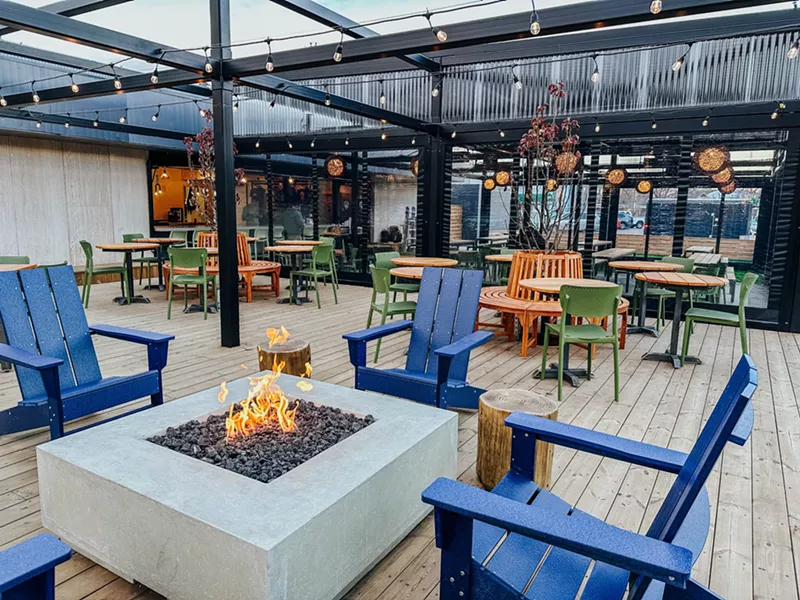 Image: Outdoor patio at a brewery with a fire pit.