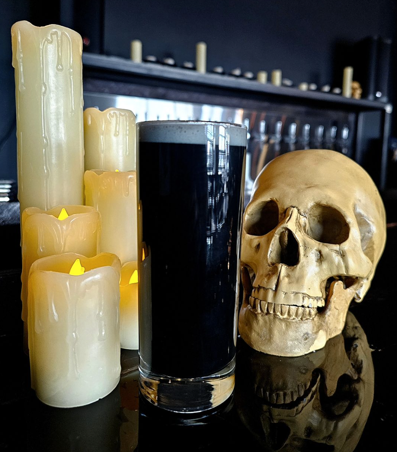 Image: Skulls, candles and a dark beer
