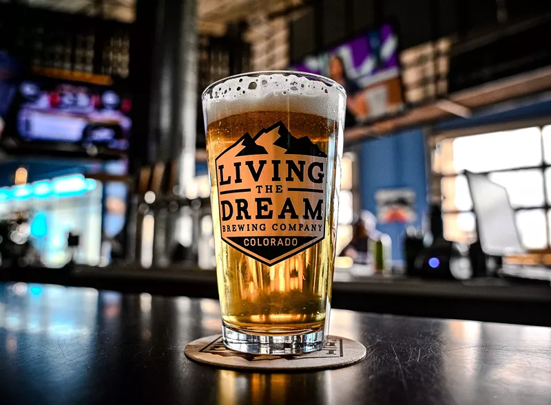 Image: Beer glass with golden beer inside.