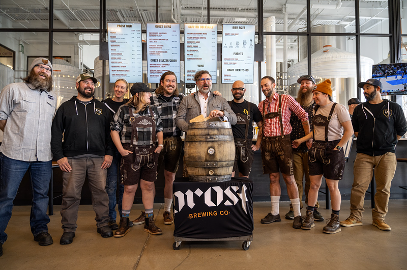 Image: Group of people with a traditional barrel tapping.