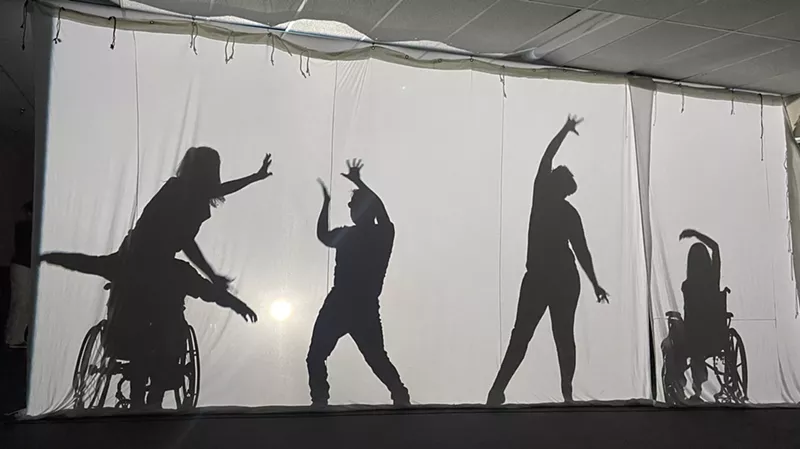 Image: shadows through a screen show people dancing