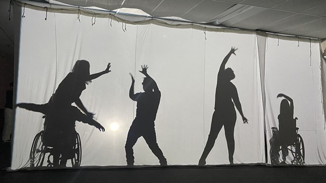 shadows through a screen show people dancing