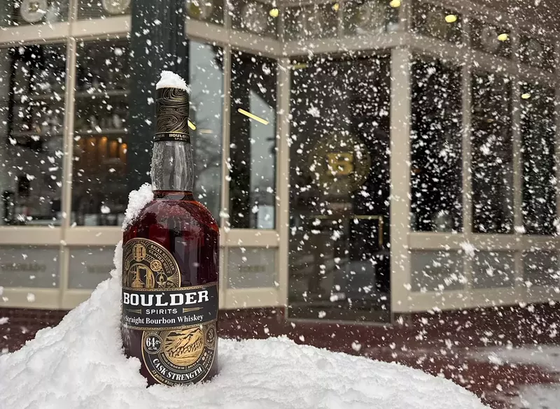 Image: bottle of bourbon in the snow