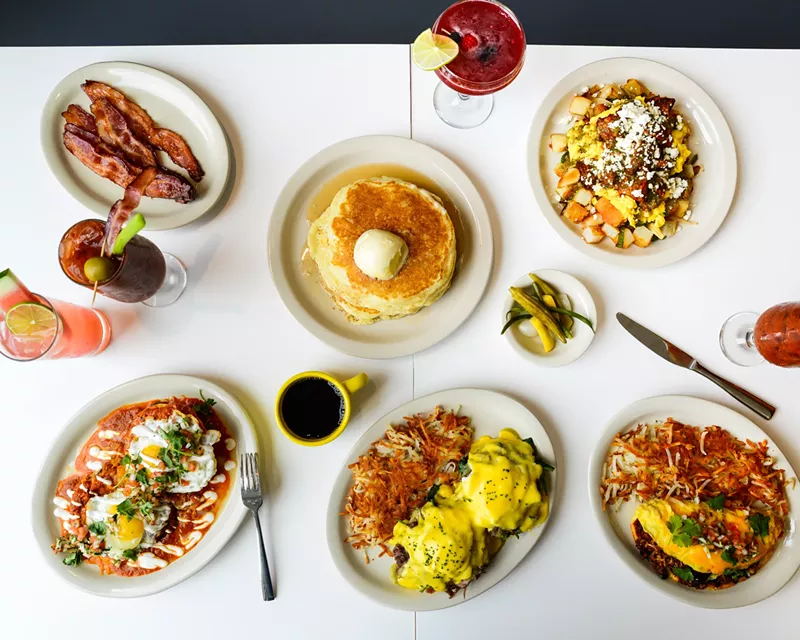 Image: various food on plates on a white table