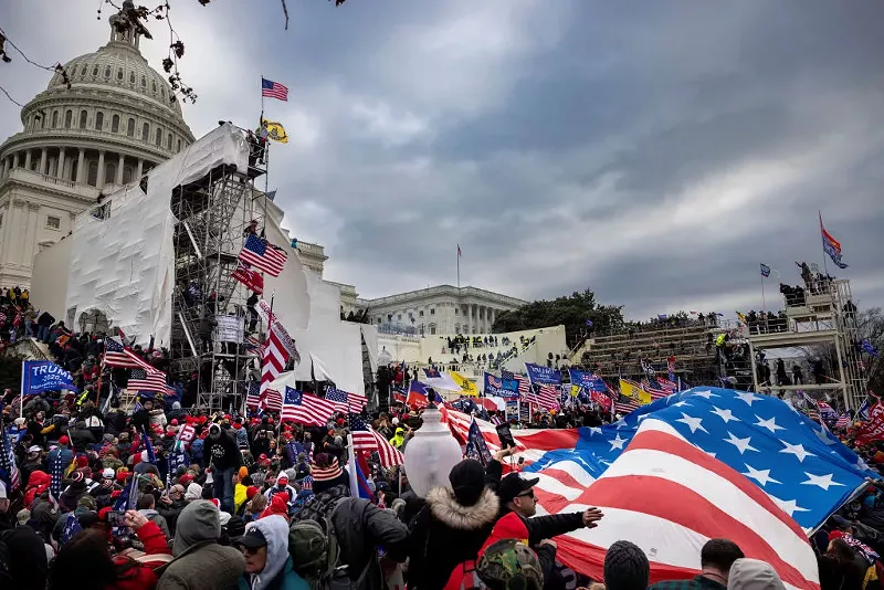 Image: scene outside U.S. Capitol, flags, protesters