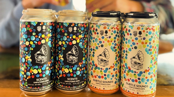 four colorful cans of beer