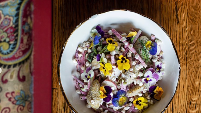 food garnished with flowers on a plate