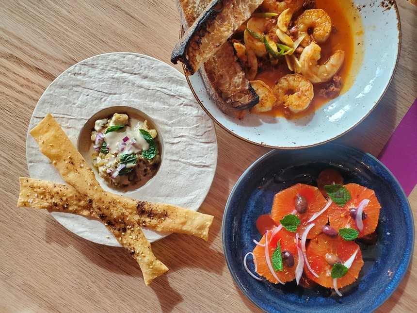 A trio of tapas: shrimp with chorizo, eggplant with tahini and oranges & olives. - MOLLY MARTIN