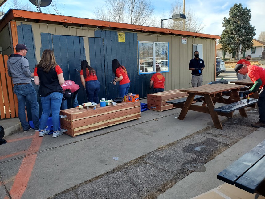On December 14, Wells Fargo volunteers stained tables and part of Restaurante El Tamarindo's exterior as part of the beautification efforts. - MOLLY MARTIN