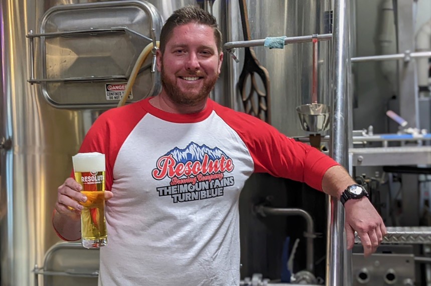 Resolute Brewing sold "The Mountains Turn Blue" T-shirts to go with its beer. - RESOLUTE BREWING