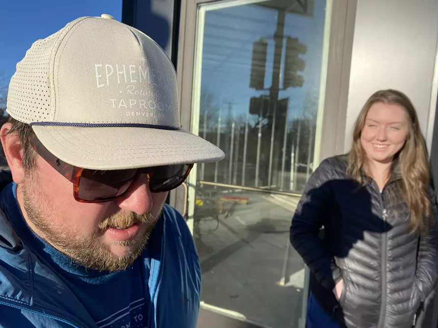 Owner Weston Scott shows off some merch in front of the taproom, set to open before June. - KRISTIN PAZULSKI