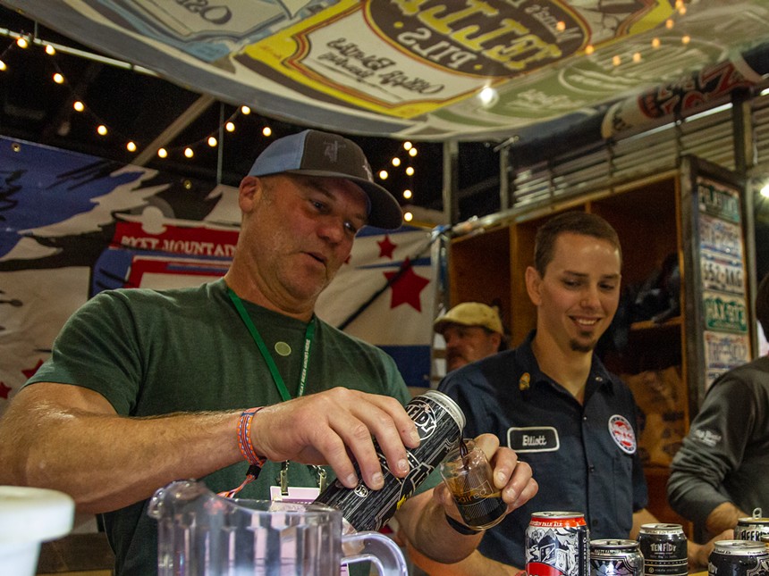 Dale Katechis (left) pours beer at GABF in 2017. - OSKAR BLUES