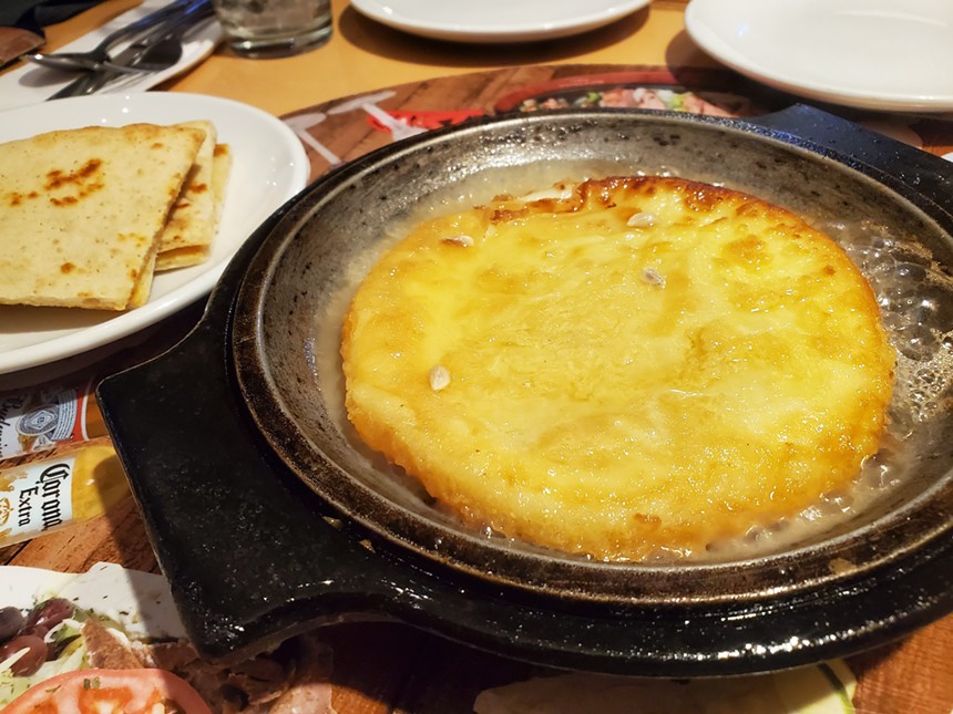 Start your meal at Looking Good with saganaki. - MOLLY MARTIN