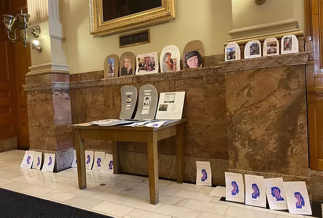 Medical marijuana patients left symbolic gravestones outside Jared Polis's office to protest his signing of HB 1317. - COURTESY OF BRIDGET DANDARA-SERITT
