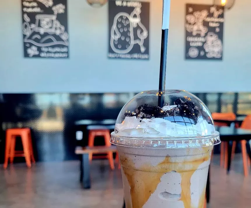 A thick shake and Keith Haring prints in the background at the new Westminster location of Chicken Rebel. - LINNEA COVINGTON