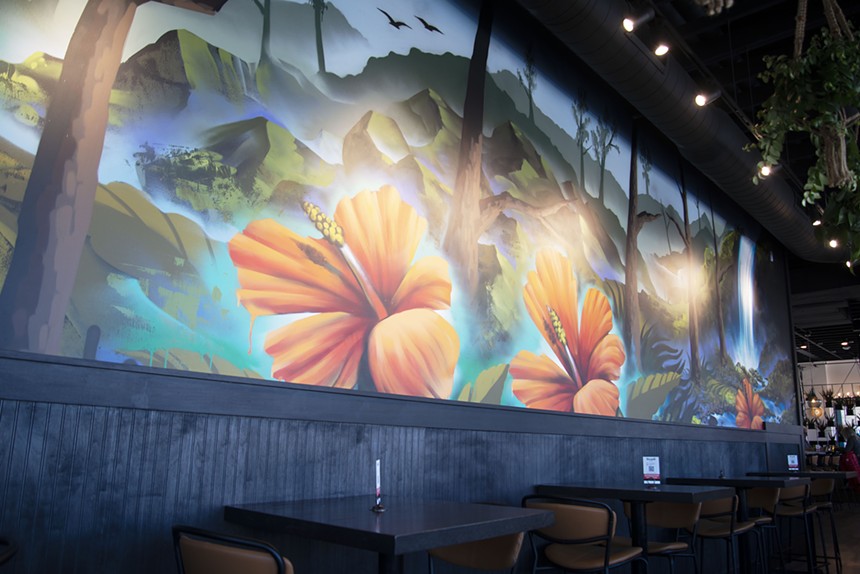 Local muralist and artist, Chad Bolsinger, completed a vibrant wall mural in Teocalli Cocina. - TOM HELLAUER