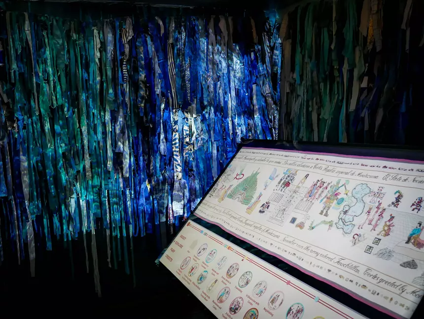 Leslie Tillett, “The Conquest of Mexico,” tapestry, with "Cenote," a tapestry n the background inspired by sinkholes found on the Yucatán Peninsula. - PHOTO: STEVE BERNINI