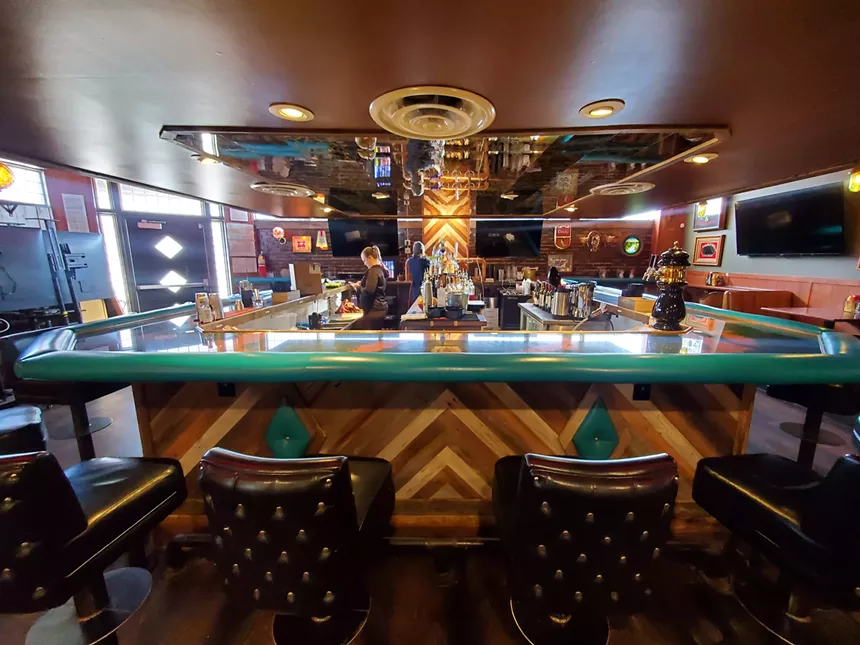 There are enough seats at the bar of the Campus Lounge. - Molly Martin