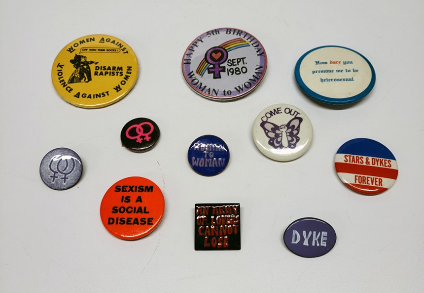 Vicki Piotter, the co-founder of Woman to Woman Feminist Bookcenter, donated these pins from the lesbian feminist movement in Colorado that took place from the 1970s through the 1990s. - COURTESY OF HISTORY COLORADO