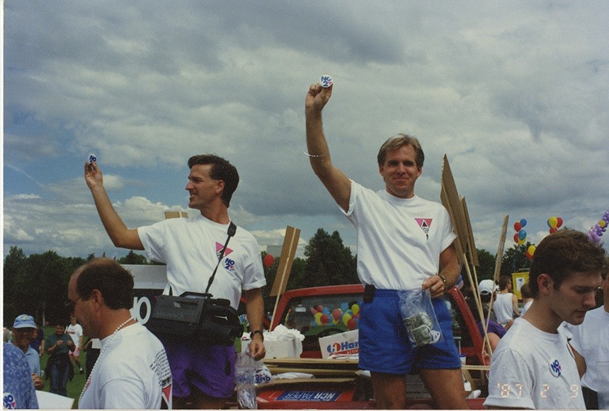 Colorado activists Tim Robinson and Frank Brown sell "No on 2" buttons at the March on Washington in 1993. - COURTESY OF HISTORY COLORADO