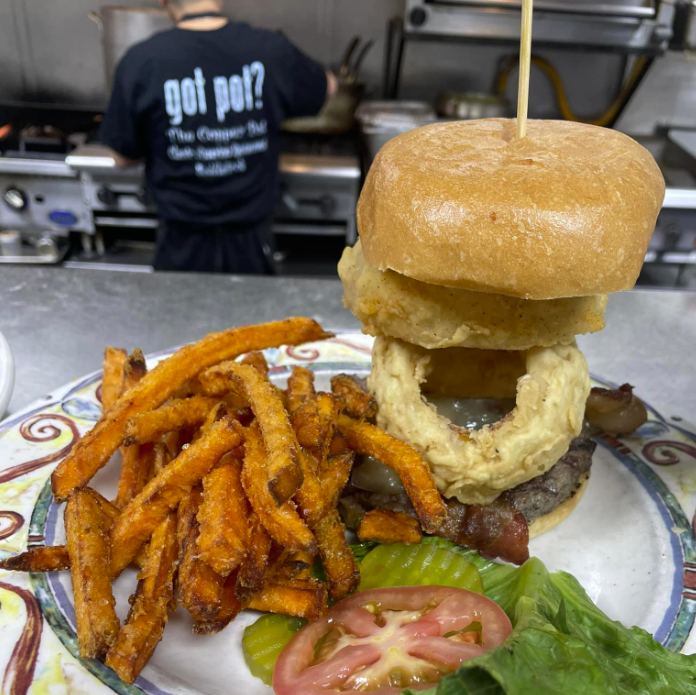 A loaded burger at the Copper Pot at Saddle Rock. - THE COPPER POT AT SADDLE ROCK/FACEBOOK