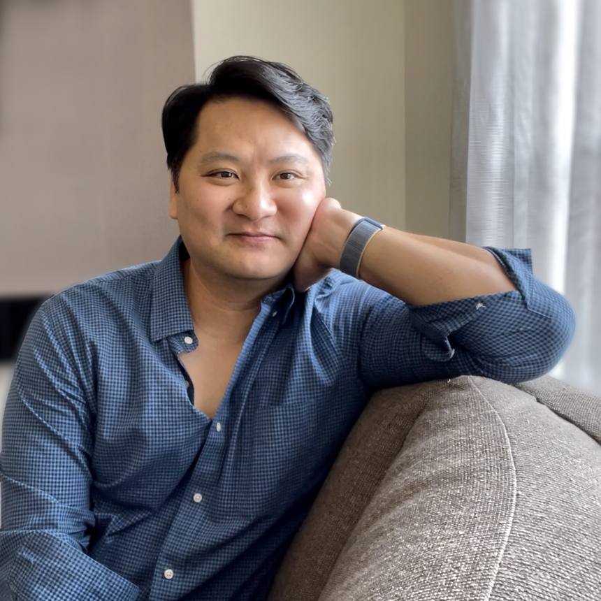 asian man in blue shirt