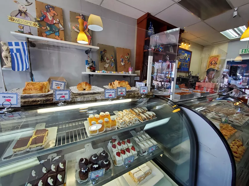 bakery case fill with cakes and cookies