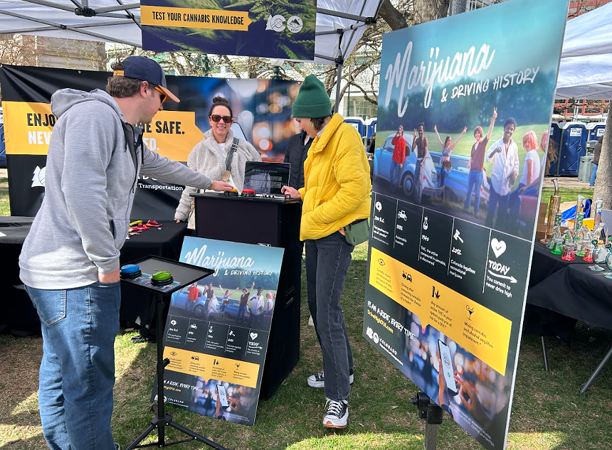 People talking at the CDOT booth at this year's Mile High 4/20 Festival at Civic Center Park.