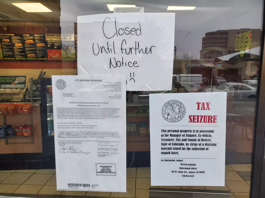 notices hand on the door of a restaurant