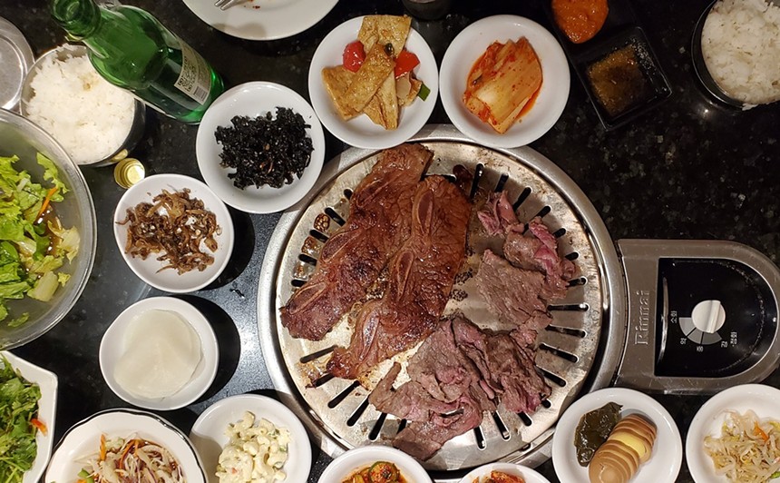 Korean barbecued meat and banchan dishes